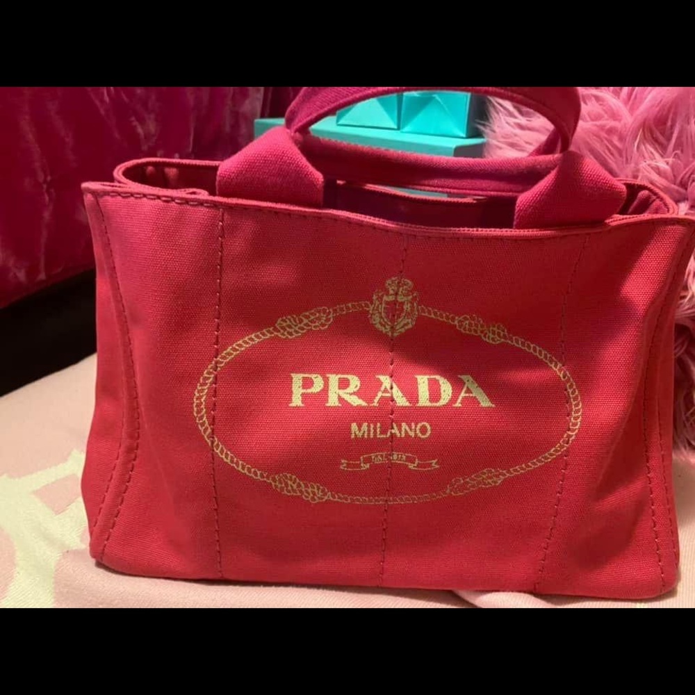 Pink Prada Canapa in good condition. Comes with authenticity card and strap